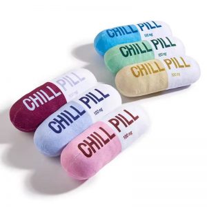 Capsule shaped Chill Pill plush squeaky dog toy for pets